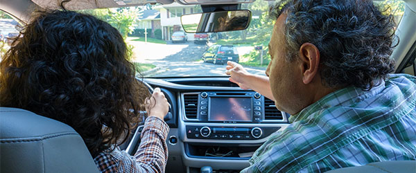 Teen and parent in car